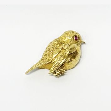 HERMÈS PARIS, Broche en or 18k (750e) stylisant un moineau