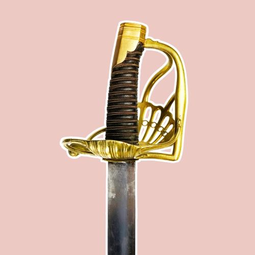 Sabre de cavalerie à garde de bataille. Monture en bronze à palmette.