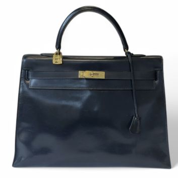 HERMÈS Sac Kelly sellier, 35 cm, en veau box noir, doublure en chèvre noir, bijouterie en métal plaqué or