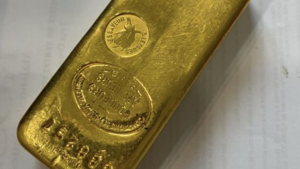 Lingot en or (996.7), numéroté 688257 Poids brut 1kg.